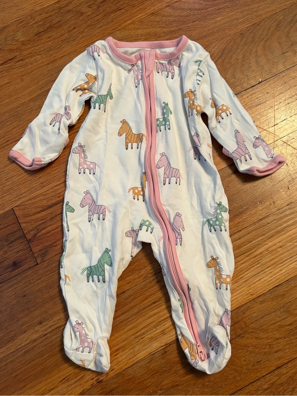 Kissy Kissy White Footed One-Piece with Pink Trim and Pastel Animal Motifs